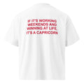 IF IT'S WORKING WEEKENDS AND WINNING AT LIFE, IT'S A CAPRICORN oversized t-shirt – white back view | So True
